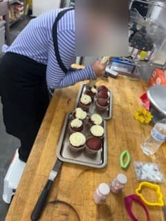 Frosting cupcakes at Antonio's Macarons camp