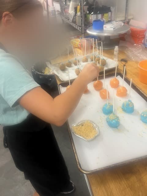 Mixing ingredients at Antonio's Macarons class