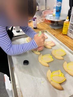 Decorating tulip cookies at Antonio's Macarons camp
